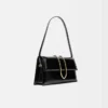 La borsa lunga Bambino Long con patta metallica La borsa lunga Bambino Long con patta metallica