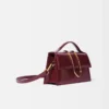 La grande borsa a tracolla con patta metallica Bambino La grande borsa a tracolla con patta metallica Bambino