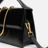 La grande borsa a tracolla con patta metallica Bambino La grande borsa a tracolla con patta metallica Bambino