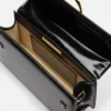 La grande borsa a tracolla con patta metallica Bambino La grande borsa a tracolla con patta metallica Bambino