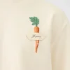 La t-shirt carota T-shirt con logo e toppa a forma di carota La t-shirt carota T-shirt con logo e toppa a forma di carota