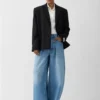Pantaloni in denim Ovalo de-Nîmes Jeans curvi a vita alta Pantaloni in denim Ovalo de-Nîmes Jeans curvi a vita alta