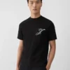 The Logo t-shirt T-shirt a maniche corte con loghi ricamati The Logo t-shirt T-shirt a maniche corte con loghi ricamati